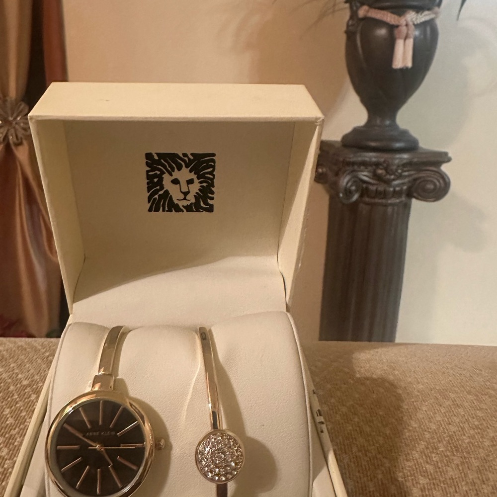 Anne Klein Black and Gold Watch with Crystal Accent Bracelet